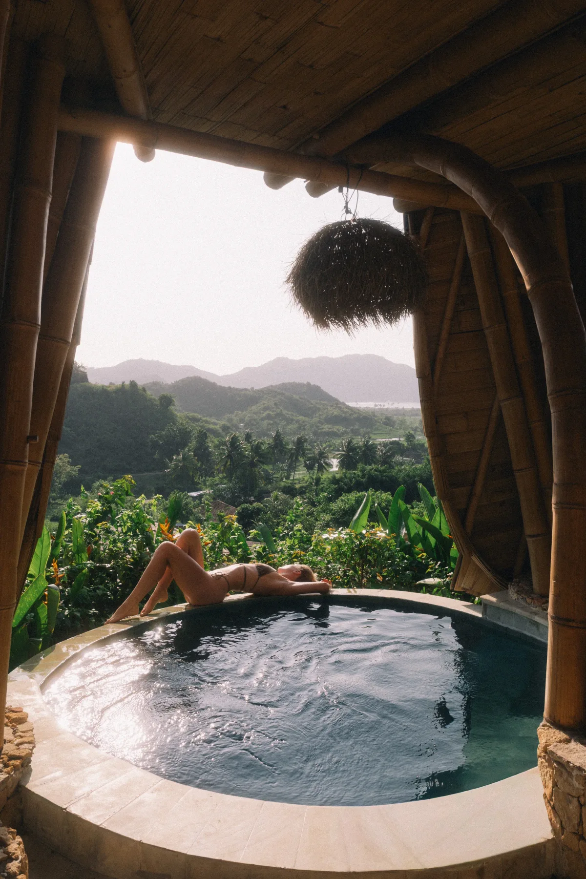 Circular plunge pool with hill views at Anima Shala villa, Lombok